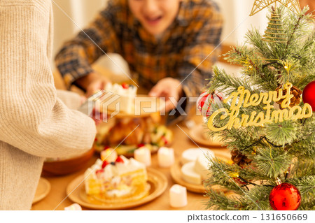 Family having a Christmas home party Family having a Christmas home party 131650669