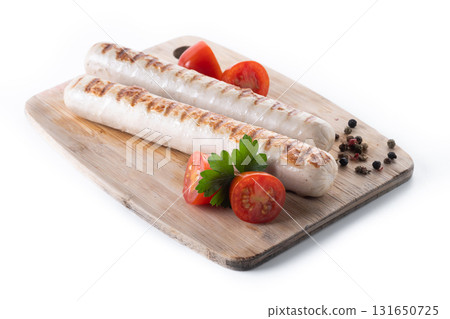 Grilled white sausages with cherry tomatoes and parsley 131650725