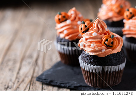 Halloween cupcakes with Halloween sprinkles on wooden table 131651278