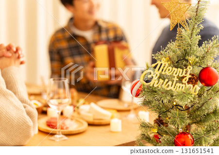 Family having a Christmas home party 131651541