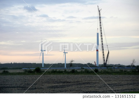 Wind tower turbine power plant at sunset Wind tower turbine power plant at sunset 131651552