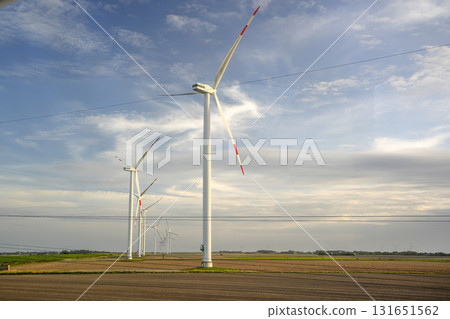 Wind tower turbine power plant at sunset Wind tower turbine power plant at sunset 131651562