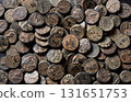 Pile of ancient Greek coins of Seleucid Empire, top view of bronze money, vintage texture background, concept of antique 131651753