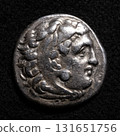 Ancient Greek coin of Alexander the Great with head of Hercules in lion skin, vintage silver drachma, textured metal money 131651756
