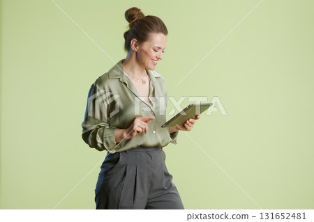 Woman interacting with a tablet Woman interacting with a tablet 131652481
