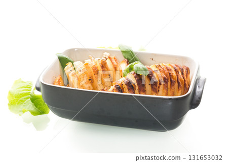 Classic potatoes with lard, baked until golden brown 131653032