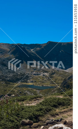 Mountain view of the Rila Mountains in Bulgaria. Seven Rila Lake hike. Eco trails. Connection with nature. Mountain view of the Rila Mountains in Bulgaria. Seven Rila Lake hike. Eco trails. Connection with nature. 131653938