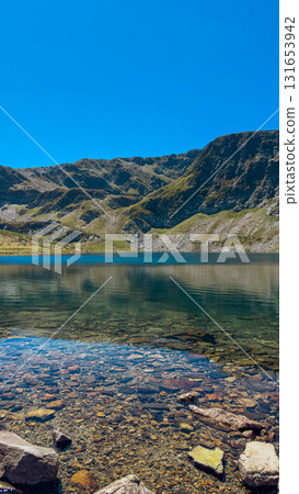 Mountain view of the Rila Mountains in Bulgaria. Seven Rila Lake hike. Eco trails. Connection with nature. Mountain view of the Rila Mountains in Bulgaria. Seven Rila Lake hike. Eco trails. Connection with nature. 131653942