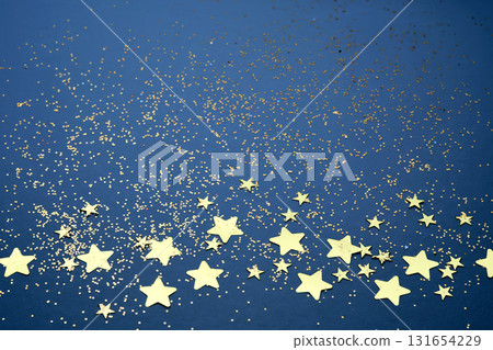 Abstract festive blue background with golden stars. 131654229
