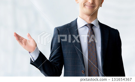 Smiling male businessman giving guidance 131654367