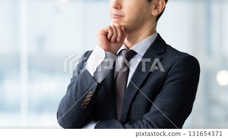 A male businessman thinking 131654371