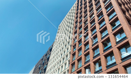 Architecture and real estate, modern residential apartment building with large panoramic windows Architecture and real estate, modern residential apartment building with large panoramic windows 131654464