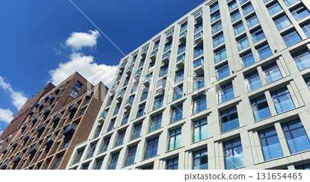 Architecture and real estate, modern residential apartment building with large panoramic windows Architecture and real estate, modern residential apartment building with large panoramic windows 131654465