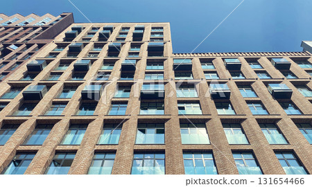 Architecture and real estate, modern residential apartment building with large panoramic windows Architecture and real estate, modern residential apartment building with large panoramic windows 131654466