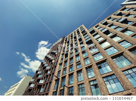 Architecture and real estate, modern residential apartment building with large panoramic windows Architecture and real estate, modern residential apartment building with large panoramic windows 131654467
