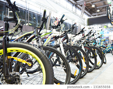 Modern mountain bikes in sports shop Modern mountain bikes in sports shop 131655038