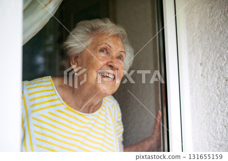 Cute old lady on balcony. Cute old lady on balcony. 131655159