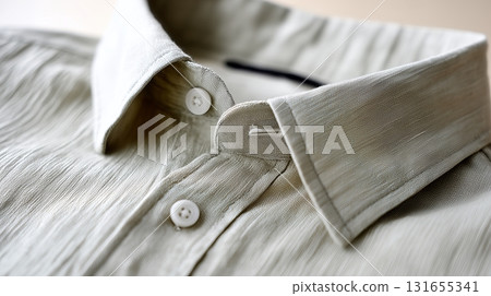 Elegant beige shirt with a stylish collar displayed on a neutral background 131655341
