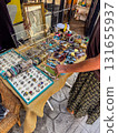 woman is choosing on Vintage Jewelry Market Stall 131655937