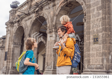 Father with his two sons visiting Chapultepec Castle in Mexico City, enjoying a cultural family trip together. Tourism, heritage exploration, and family bonding vacation concept 131655961