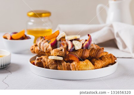 Homemade banana and berry croffles on a breakfast plate 131656320