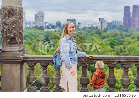 Mother with her young son near Chapultepec Castle in Mexico City, enjoying a cultural family trip. Parenthood, love, heritage sightseeing, and family bonding travel concept Mother with her young son near Chapultepec Castle in Mexico City, enjoying a cultural family trip. Parenthood, love, heritage sightseeing, and family bonding travel concept 131656580
