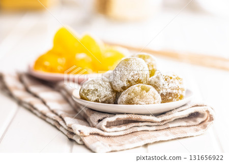 Japanese mochi dessert on plate on checkered napkin. Japanese mochi dessert on plate on checkered napkin. 131656922
