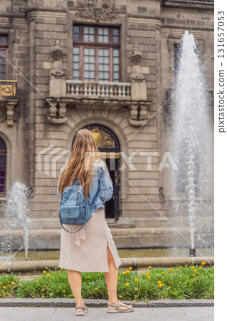 Young woman tourist standing near Chapultepec Castle in Mexico City, exploring the historic landmark. Solo travel, cultural heritage, tourism, and adventure concept Young woman tourist standing near Chapultepec Castle in Mexico City, exploring the historic landmark. Solo travel, cultural heritage, tourism, and adventure concept 131657053