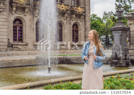 Young woman tourist standing near Chapultepec Castle in Mexico City, exploring the historic landmark. Solo travel, cultural heritage, tourism, and adventure concept 131657054