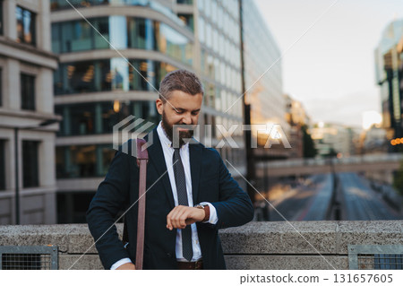 Businessman checking time on his watch. 131657605