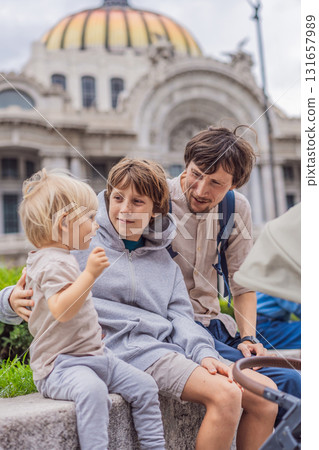 Father tourist with his two sons in front of Palacio de Bellas Artes in Mexico City, enjoying family vacation, cultural exploration, and architecture. Family travel and bonding concept Father tourist with his two sons in front of Palacio de Bellas Artes in Mexico City, enjoying family vacation, cultural exploration, and architecture. Family travel and bonding concept 131657989