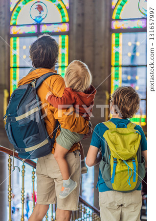 Father with his two sons visiting Chapultepec Castle in Mexico City, enjoying a cultural family trip together. Tourism, heritage exploration, and family bonding vacation concept 131657997