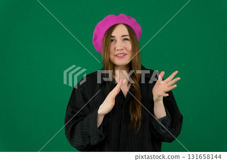 Set of videos featuring young European woman in pink beret showing various emotions and gestures on green chroma key background with copy space for advertising and social media design Set of videos featuring young European woman in pink beret showing various emotions and gestures on green chroma key background with copy space for advertising and social media design 131658144