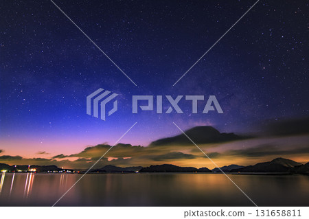 Winter starry scenery of Setouchi. The Milky Way and Scorpio rising in the twilight sky. Winter starry scenery of Setouchi. The Milky Way and Scorpio rising in the twilight sky. 131658811