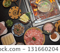 Spicy mandarin duck hot pot table with delicious ingredients 131660204