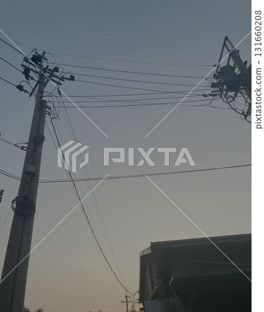 Street scene with electric poles and sky at sunset 131660208