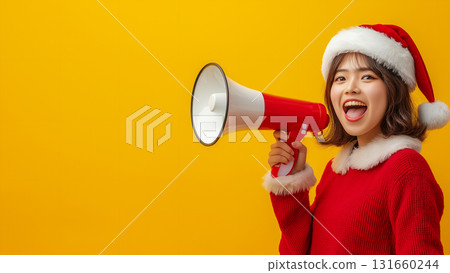 Japanese woman in Santa Claus costume holding megaphone, copy space Japanese woman in Santa Claus costume holding megaphone, copy space 131660244