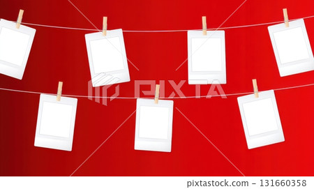 Empty photo frames on clothesline with red background 131660358