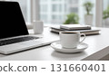 Modern minimalist workspace with laptop and coffee cup 131660401
