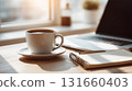 Modern minimalist workspace with laptop and coffee cup 131660403