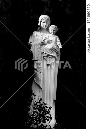 Statue of Mary holding a child Statue of Mary holding a child 131660830
