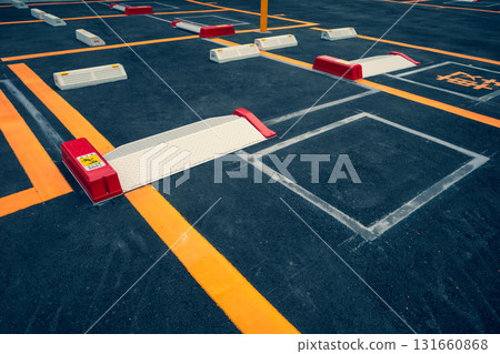 Newly constructed parking lot. Coin parking lot on former residential site. b-3. Emphasis on warm and cool colors. Newly constructed parking lot. Coin parking lot on former residential site. b-3. Emphasis on warm and cool colors. 131660868