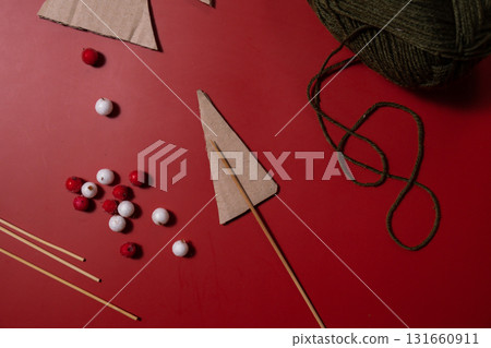 Rope Christmas trees Storytelling creating craft Christmas holiday present. Tactile hand-on activity. Master class progress of creative me-made gifts. Seasonal domestic life micro moment hobby 131660911