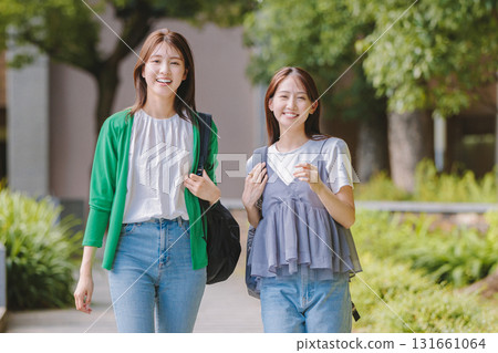 College student walking on campus with friends 131661064