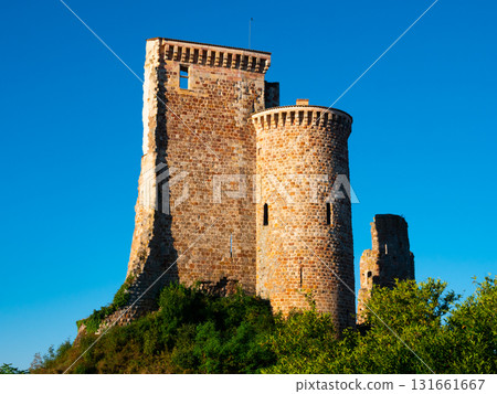 Remains of walls and tower of ancient fortified chateau in Herisson Remains of walls and tower of ancient fortified chateau in Herisson 131661667