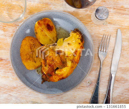 Fried chicken piece and potato slices in the plate Fried chicken piece and potato slices in the plate 131661855
