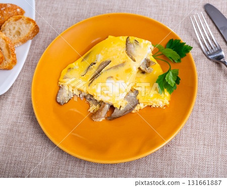 Omelette with mushrooms 131661887