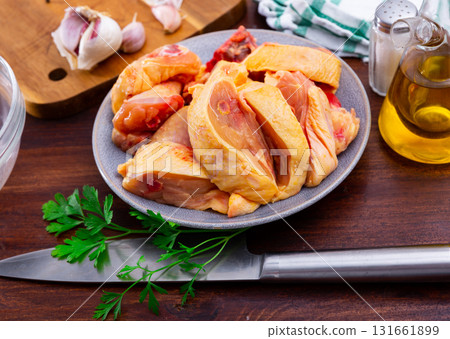 Bowl with raw sliced chicken, food preparation 131661899