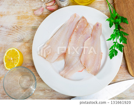 Raw rockfish fillet with condiments, cooking ingredients 131661920