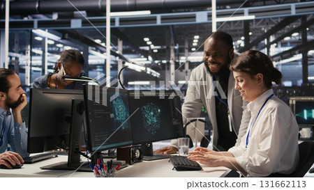 Joyous data center team leader giving high five to worker after successful infrastructure upgrade. Pleased coworkers celebrating collaborative achievement during AI systems deployment, camera A 131662113